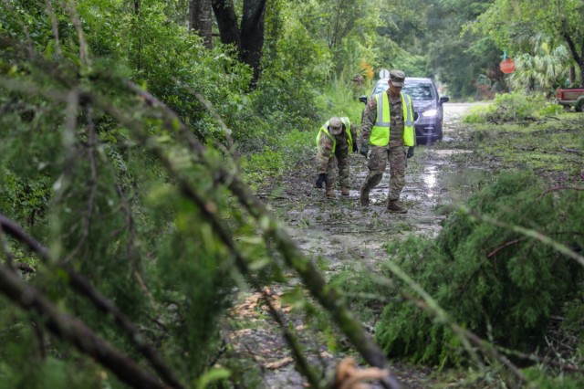 Florida Army National Guard Soldiers with the 1-265th Air Defense Artillery Battalion clear roads of debris during Hurricane Debby response operations in Lafayette County, Fla., on Aug. 5, 2024.