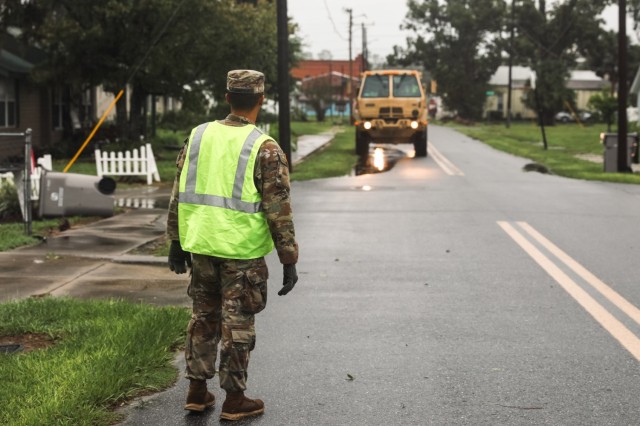 Pfc. Seth Figueroa, an air defense battle management system operator with the 1-265th Air Defense Artillery Battalion, clears roads during Hurricane Debby response operations in Lafayette County, Fla., on Aug. 5, 2024.