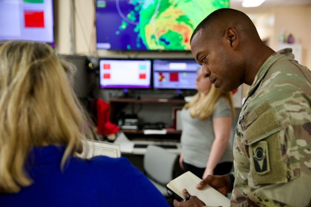 Florida Army National Guard 1st Squadron Commander, Lt. Col. Daniel S. Brown, with the 153rd Cavalry Regiment, discusses potential impacted areas of Hurricane Debby at the Franklin County Emergency Operations Center with Franklin County Director...