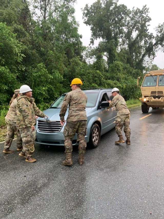 Soldiers from the 868th Engineer Construction Company assist a stranded vehicle during Hurricane Debby response operations on Aug. 5, 2024. The FLARNG worked tirelessly to support the community and ensure safety during the storm.