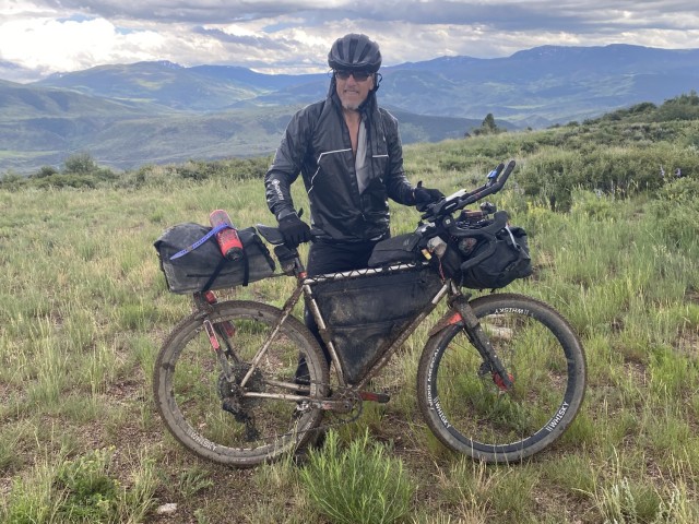 Robert Wells of Fort Walker, VA takes a break in the Rocky mountains during the Tour Divide race.