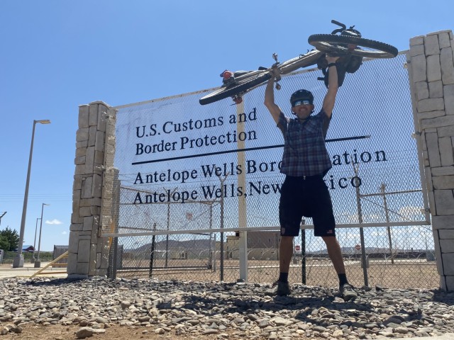 Robert Wells at the finish of the 2,450 mile Tour Divide bike race in Antelope Wells, New Mexico