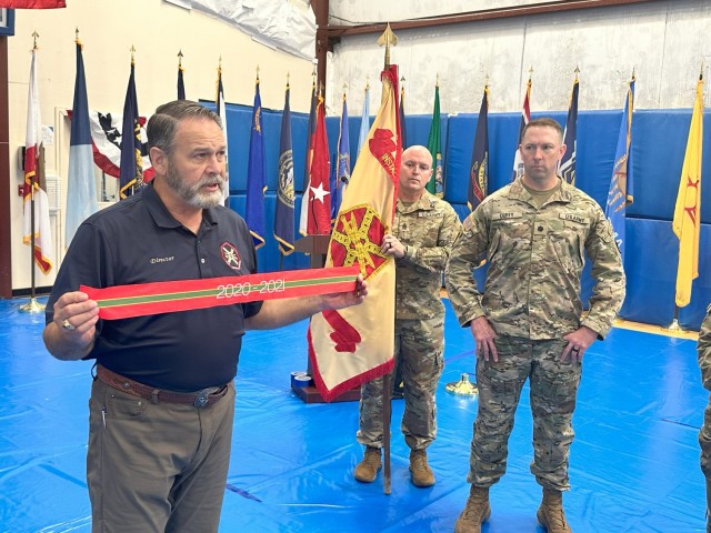 FORT WALKER, VIRGINIA - Davis D. Tindoll, Jr. Director, U.S. Army Installation Management Command – Sustainment Directorate, presents the Army Superior Unit Award to Fort Walker officials as the installation’s former garrison commander, Lt....