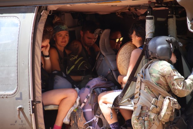 U.S. Army Soldiers of the Arizona National Guard (AZNG) guide tourists into a UH-60 Blackhawk, August 24, 2024 at the Havasupai Indian Reservation....