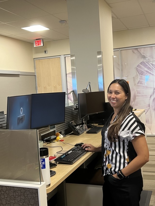 Nicole Gutierrez, Presidio of Monterey Clinical Case Coordinator, stands at her desk inside of the Gourley VA Clinic in Marina, Calif.