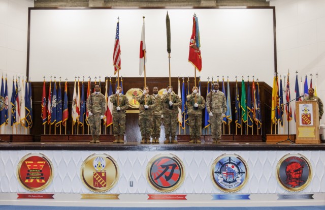 A color guard displays the U.S. and Japan flags and the unit colors for the 765th Transportation (Terminal) Battalion on the right during a reflagging ceremony inside Kizuna Hall at Camp Zama, Japan, July 31, 2024. The ceremony signified the 35th...