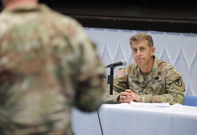 Col. Marcus Hunter, commander of U.S. Army Garrison Japan, listens to a question from a resident during a housing town hall at Camp Zama, Japan, Aug. 29, 2024.