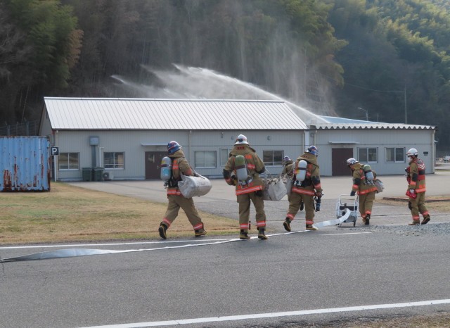 Kure Fire Department firefighters participate in a joint training exercise with U.S. Army Garrison Japan firefighters at Hiro Ammunition Depot, Japan, Feb. 13, 2024. Garrison firefighters have recently stepped up their efforts to strengthen...