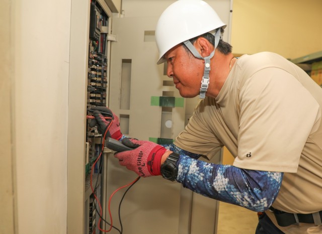 Hideki Yamada, an electrician for the Directorate of Public Works, performs a test on circuit breakers at the Akizuki Ammunition Depot in Japan, Sept. 5, 2024. The DPW workforce handles various skilled trade and office jobs to support tenant...