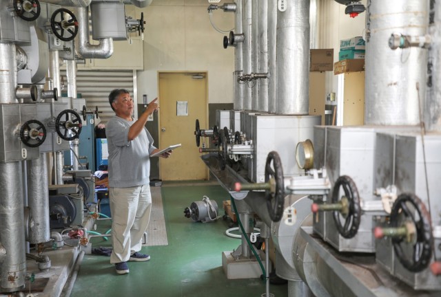 Tomonori Oshita, a boilerman for the Directorate of Public Works, inspects a boiler system at the Akizuki Ammunition Depot in Japan, Sept. 5, 2024. The DPW workforce handles various skilled trade and office jobs to support tenant organizations,...