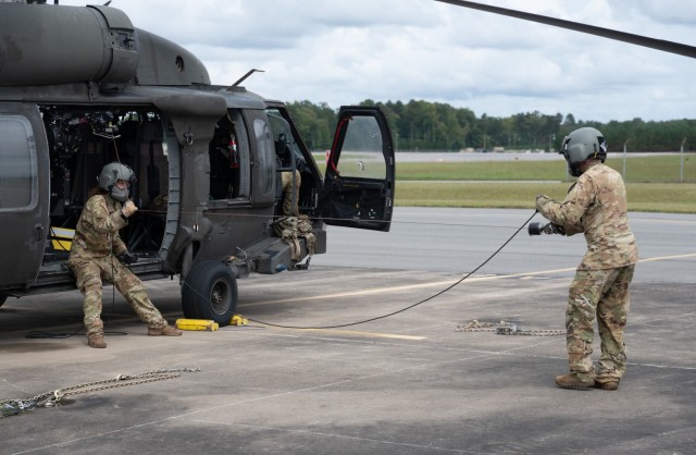Virginia National Guard Soldiers assigned to the Sandston-based 2nd Battalion, 224th Aviation Regiment, 29th Infantry Division in-process and prepare UH-60 Black Hawks for possible missions related to Hurricane Helene Sept. 26, 2024, at the Army...