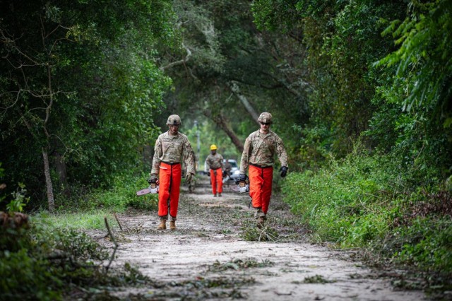 FLARNG Soldiers from the 753rd Brigade Engineering Battalion clear debris from roads in Bell, Fla., on Saturday, September 28, 2024. Response to Hurricane Helene is a massive team effort, and FLARNG fully mobilizes all available forces.