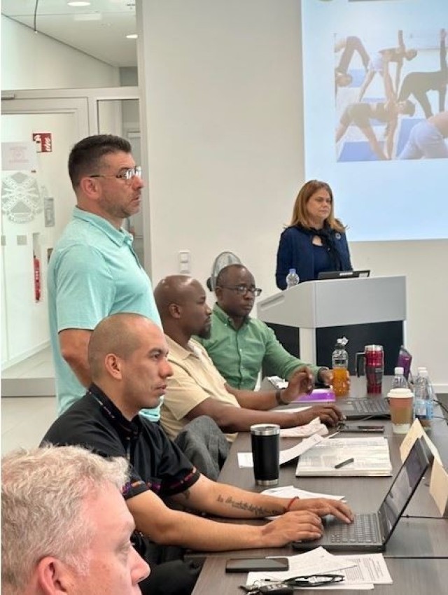 Magda Figueroa (right) teaches at the the Equal Employment Opportunity Counselor’s certification training in Wiesbaden, Germany.
