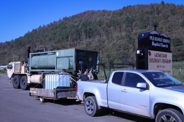 U.S. Army National Guard water treatment specialists, assigned to Alpha Company 169th Divisional Sustainment Support Battalion, distribute water in rural Mountain City, Tennessee, Oct. 6, 2024. The Tennessee National Guard is assisting with...