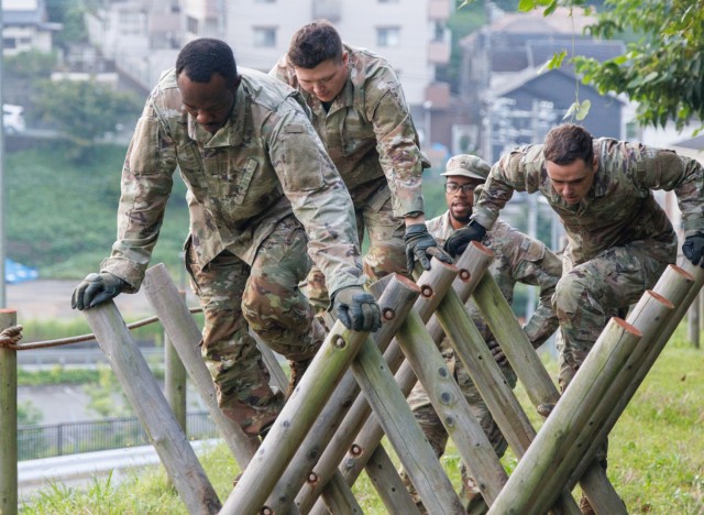 Army culinary specialists go through an obstacle course as part of a two-day exercise to hone their Soldier skills at Camp Zama, Japan, Oct. 7, 2024. Teams of Soldiers assigned to the 765th Transportation Terminal Battalion’s 5th Transportation...