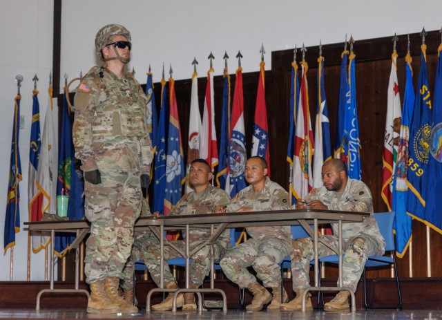 An Army culinary specialist participates in a culinary board inside Kizuna Hall as part of a two-day exercise at Camp Zama, Japan, Oct. 7, 2024.