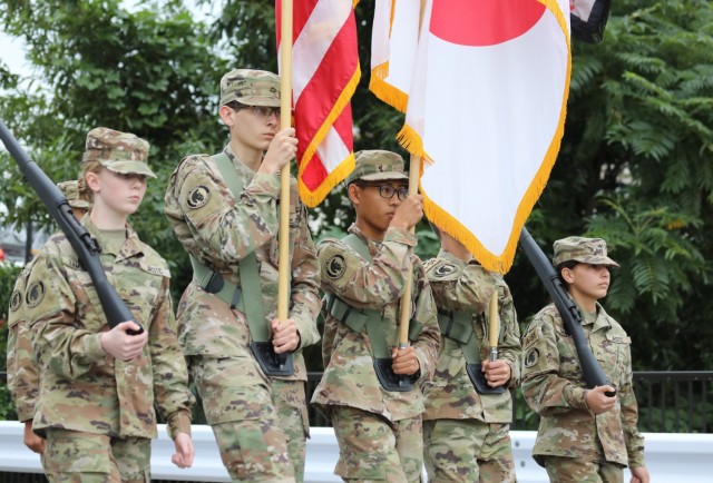 A color guard from Zama Middle High School's Junior Reserve Officers' Training Corps participate in a homecoming parade at Camp Zama, Japan, Oct. 10, 2024.