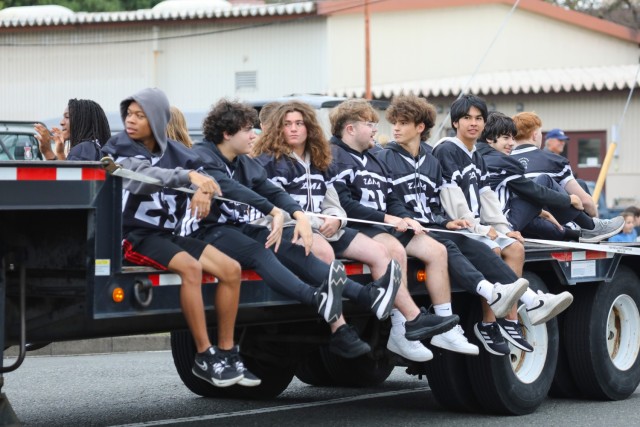 Zama High School football players participate in a homecoming parade at Camp Zama, Japan, Oct. 10, 2024. Several U.S. Army Garrison Japan personnel helped with the parade and a bonfire that night in support of the school.