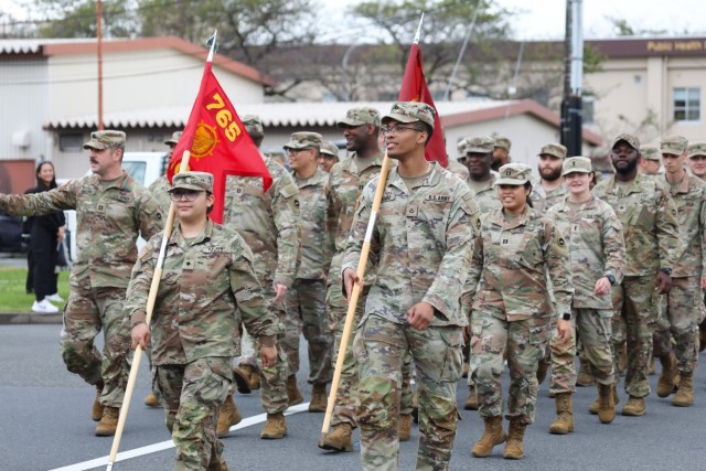 Soldiers assigned to the 765th Transportation Terminal Battalion march in a homecoming parade at Camp Zama, Japan, Oct. 10, 2024. Several U.S. Army Garrison Japan personnel also helped with the parade and a bonfire that night in support of Zama...