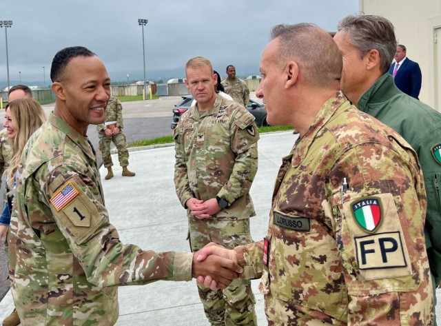 Col. Scott Horrigan, commander, U.S. Army Garrison Italy looks on as Maj. Gen. Andrew Gainey, commander, Southern European Task Force, Africa introduces himself to Italian Chief Master Sgt. Vito Lorusso, Oct. 9 at Aviano Air Base.