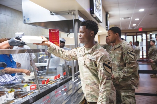 Pfc. Ishmiel Williams, 2nd Battalion, 7th Cavalry Regiment, 3rd Armored Brigade Combat Team, receives his lunch at the Headquarters Department of the Army Go for Green Action Station Oct. 9, 2024, at the Operation Iraqi Freedom Dining Facility at...