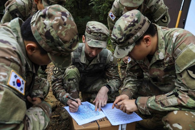 U.S. Army Staff Sgt. Daniel Giles, assigned to Headquarters & Headquarters Company, Camp Casey Garrison, guides Korea Augmentation to the United States (KATUSA), assigned to Headquarters & Headquarters Company, Camp Casey Garrison, through...