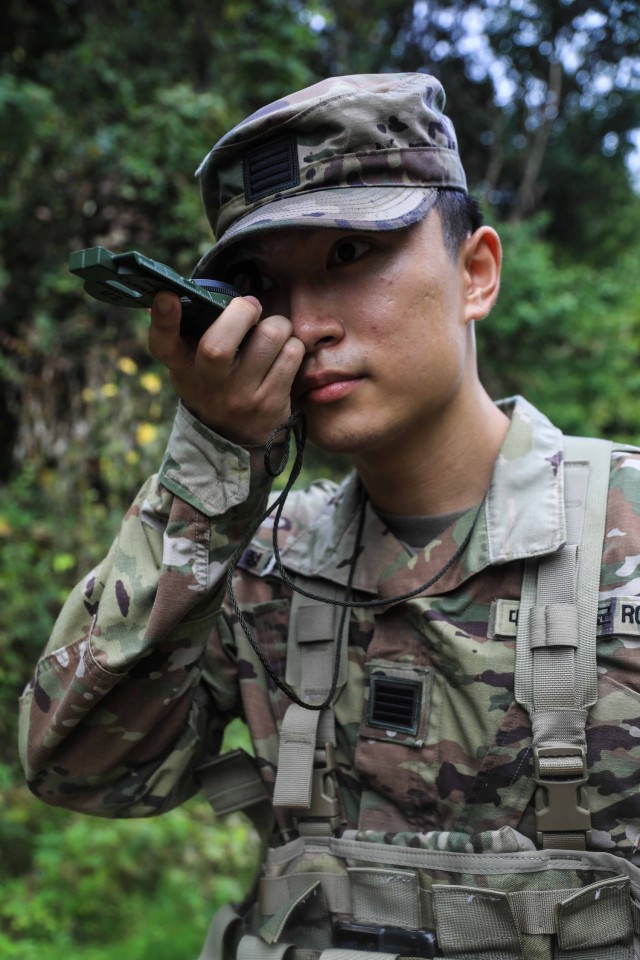 Korea Augmentation to the United States (KATUSA) Cpl. Lee, Jeonghun uses a compass during land navigation training at Camp Casey, Oct. 15, 2024. Using a compass enhances land navigation by providing reliable directional guidance, helping soldiers...
