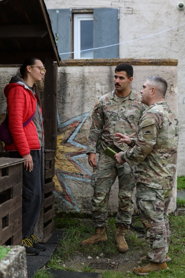 The Kosovo Forces 34 (KFOR) Liaison Monitoring Team (LMT) goes into a Kosovo community and speaks with a civilian role-player to gather information that assists KFOR in predicting flash point events that may hinder their ability to provide a safe...