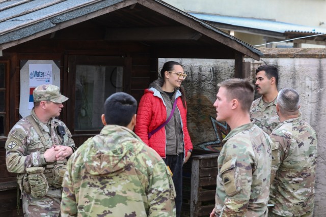 The Kosovo Forces 34 (KFOR) Liaison Monitoring Team (LMT) goes into a Kosovo community and speaks with a civilian role-player to gather information that assists KFOR in predicting flash point events that may hinder their ability to provide a safe...