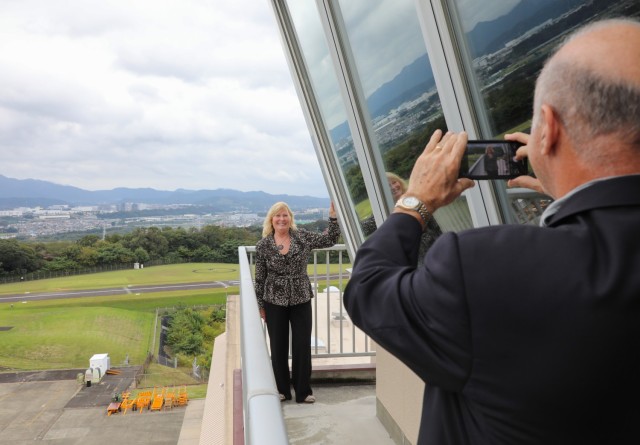 Ron Cox takes a photo of Trudy Floyd, who was born on Camp Zama in 1959, while they visit the installation's air traffic control tower in Japan, Oct. 25, 2024. U.S. Army Garrison Japan organized a tour for Floyd, who wanted to reconnect with...