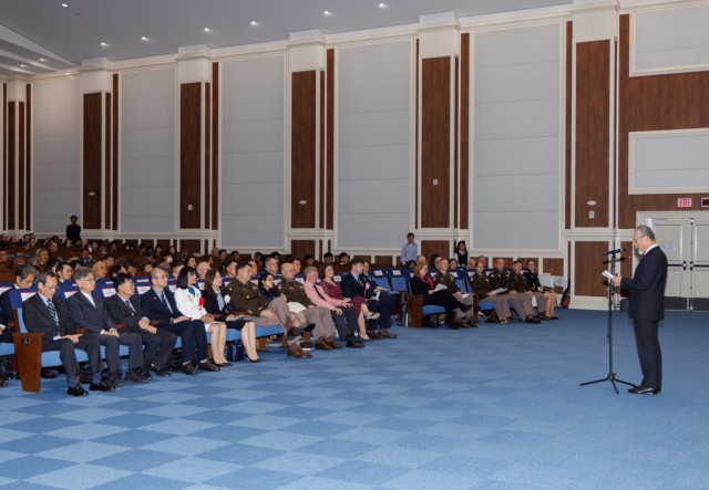Tsuyoshi Sugahara, right, an engineer technician for the Directorate of Public Works, provides remarks on behalf of the awardees during a length-of-service ceremony at Camp Zama, Japan, Oct. 29, 2024. The ceremony recognized 250 local employees...