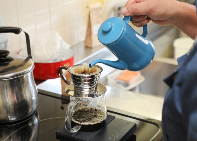 Eishin Marumoto, a U.S. Army Garrison Japan fire alarm dispatcher, uses a pour-over method to make a pot of coffee inside the Akizuki Ammunition Depot fire station in Japan Sept. 5, 2024. Marumoto has a strong passion for coffee that he likes to...