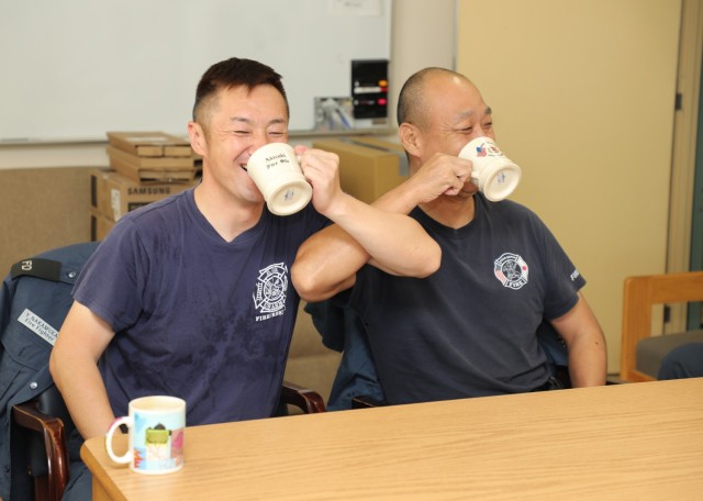 A pair of firefighters enjoy some coffee and conversation inside the Akizuki Ammunition Depot fire station in Japan Sept. 5, 2024. Eishin Marumoto, a U.S. Army Garrison Japan fire alarm dispatcher, has a strong passion for coffee that he likes to...