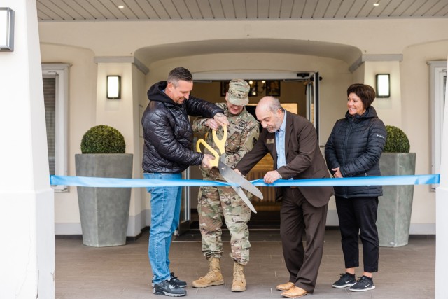 Christian Kaesemann, owner of The Italian Grill, and USAG Wiesbaden Commander Col. Troy Danderson cuts the ribbon at the restaurant's official grand opening at The Airlift on Clay Kaserne Nov. 7, 2024. (Wiesbaden FMWR Photo by Travis Thurston)