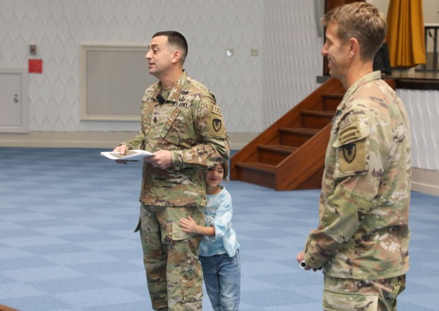 Command Sgt. Maj. David A. Rio, left, senior enlisted leader of U.S. Army Garrison Japan, who can be seen with his daughter, Evelyn, addresses children and parents participating in the "Bring Your Kids to Work Day" event at Camp Zama,...