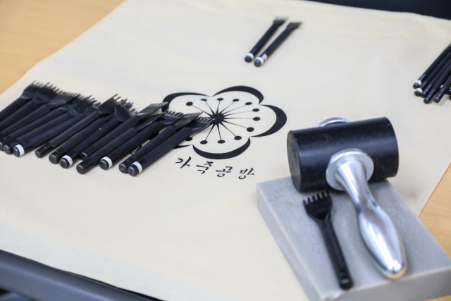 Leatherworking tools are staged on a table during a Newcomers Cultural Awareness and Immersion Tour hosted by Dongducheon city, Bosan-dong Community Center, Bosan-dong, South Korea, Dec. 13, 2024. The tour included a trip to General Eo, Yu-so's...