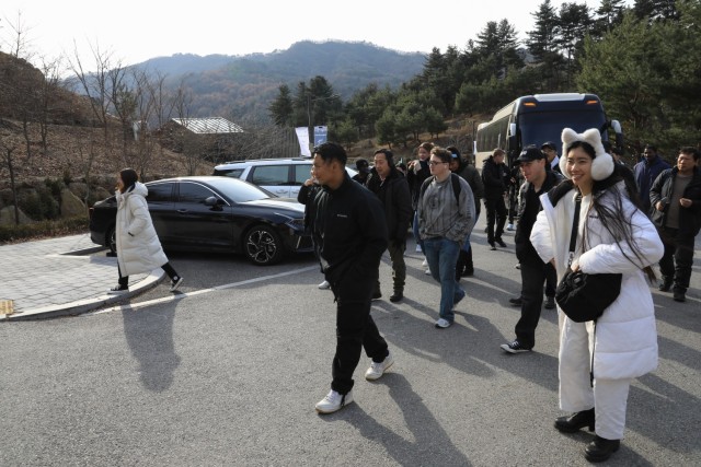 A group of 28 U.S. Soldiers, KATUSAs, and civilians assigned to U.S. Army Garrison Yongsan-Casey and 210th Field Artillery Brigade disembark a bus before hiking through a natural recreation forest during a Newcomers Cultural Awareness and...