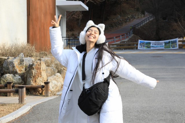 U.S. Army 2nd Lt. Victoria Nguyen, assigned to 1st Battalion, 38th Field Artillery Regiment, 210th Field Artillery Brigade, smiles happily while hiking at a natural recreation forest during a Newcomers Cultural Awareness and Immersion Tour hosted...