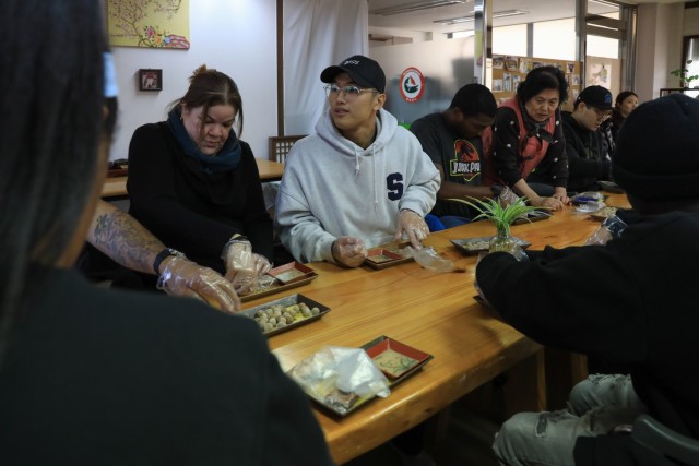 U.S. Soldiers, KATUSAs, and civilians assigned to U.S. Army Garrison Yongsan-Casey and 210th Field Artillery Brigade hand-press dasik during a Newcomers Cultural Awareness and Immersion Tour hosted by Dongducheon city, South Korea, Dec. 13, 2024....