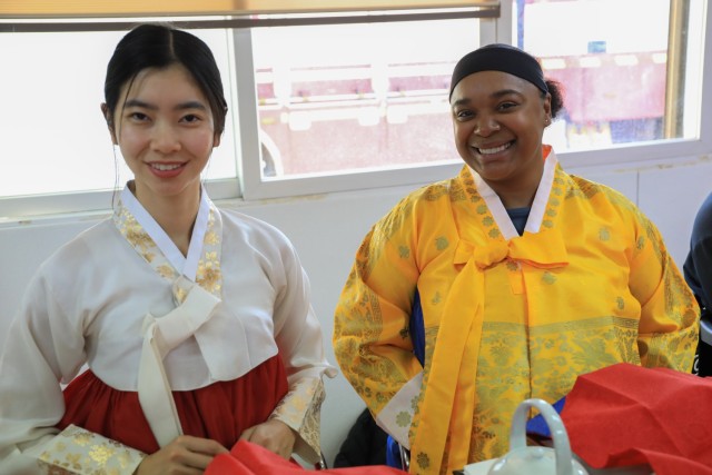 U.S. Army 2nd Lt. Victoria Nguyen, assigned to 1st Battalion, 38th Field Artillery Regiment, 210th Field Artillery Brigade, left, and U.S. Army Pfc. Tristin Hunt, U.S. Army Garrison Yongsan-Casey, wear hanboks at a traditional tea ceremony during...