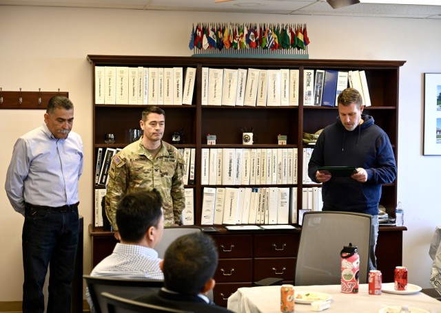Adam Hollrith, right, U.S. Army Garrison Presidio of Monterey public works director, presents Oscar Ordonez, U.S. Army Garrison Presidio of Monterey housing chief, with the meritorious civilian service medal during a ceremony at the Ord Military...