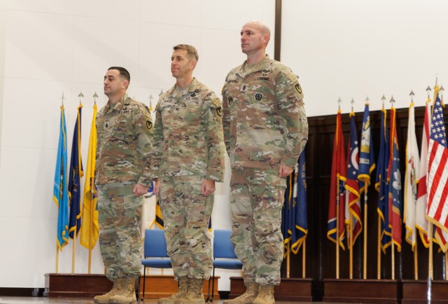Col. Marcus Hunter, center, commander of U.S. Army Garrison Japan, stands with Command Sgt. Maj. David A. Rio, left, and Command Sgt. Maj. Rick Meeker during a change of responsibility ceremony at Camp Zama, Japan, Dec. 12, 2024. Rio, who plans to...