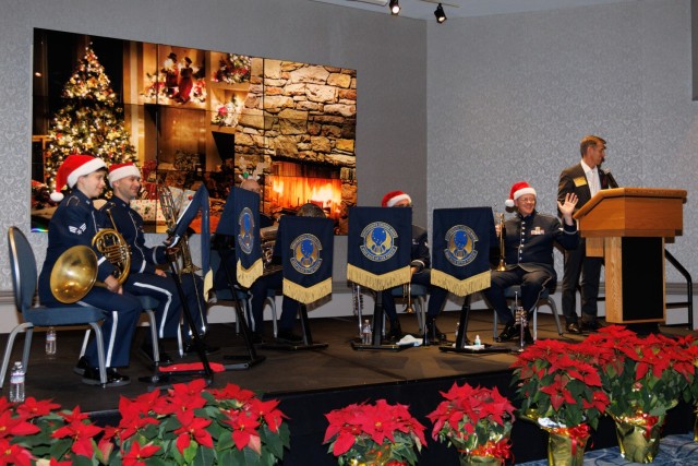 Col. Marcus Hunter, right, commander of U.S. Army Garrison Japan, introduces the U.S. Air Force Band of the Pacific-Asia during a holiday reception at Camp Zama, Japan, Dec. 16, 2024. More than 200 local community leaders and Camp Zama personnel...