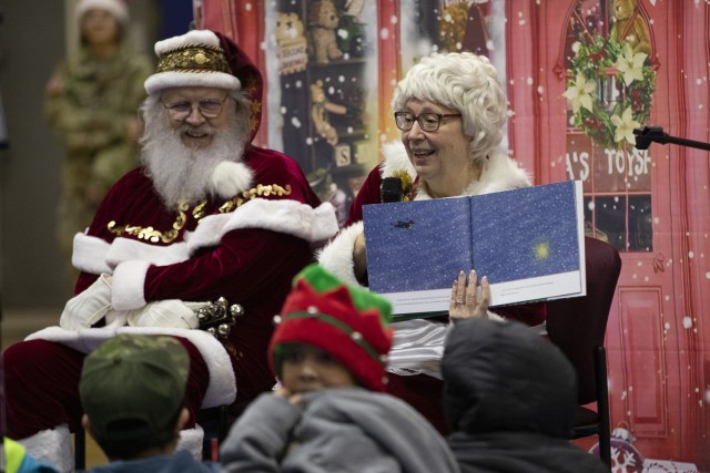 Mrs. Claus reads to the children of Yakutat in their school gymnasium as part of Operation Santa Claus in Yakutat, Alaska, Dec. 18, 2024. Operation Santa Claus, a longstanding annual community outreach program of the AKNG, has provided gifts such...