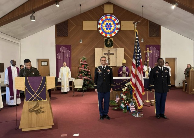 Chaplain (Col.) David Curlin (center-left) and Chaplain (Col.) John Ijeoma (center-right), U.S. Army Garrison Stuttgart command chaplain and deputy command chaplain, respectively, stand at attention at the Patch Chapel on Dec. 8, 2024, during a...