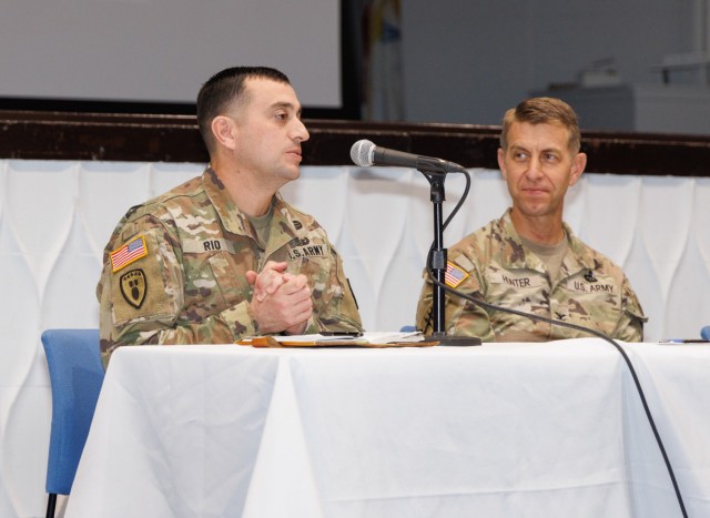 Command Sgt. Maj. David A. Rio, left, U.S. Army Garrison Japan senior enlisted leader, answers a question while Col. Marcus Hunter, garrison commander, watches on during a workforce town hall at Camp Zama, Japan, Dec. 3, 2024. The leaders...