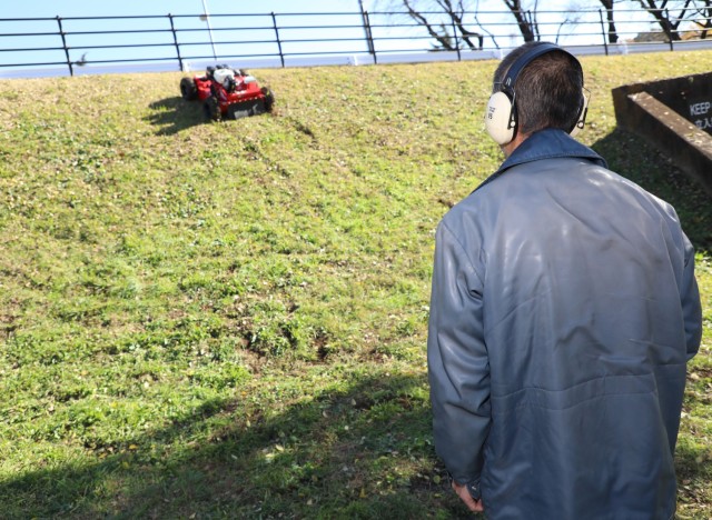 A vendor demonstrates a Sanyokiki remote-controlled lawnmower to Directorate of Public Works employees at Camp Zama, Japan, Dec. 6, 2024. DPW crews plan to use the mower to cut grass on the installation’s steep hills.