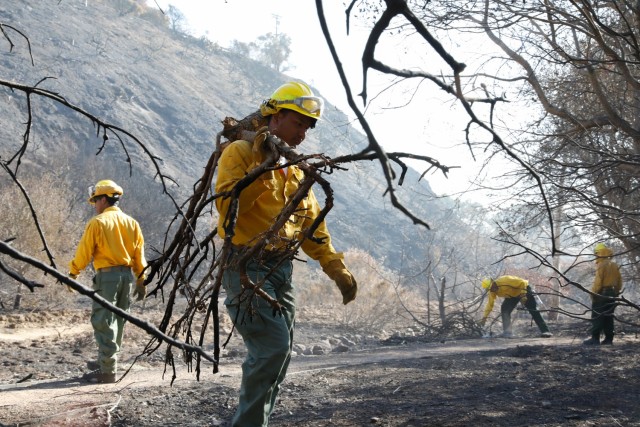 U.S. Army Cpl. Gled Navarro, a handcrew from Company B, 1st Battalion, 160th Infantry Regiment, 79th Infantry Brigade Combat Team, California Army National Guard, conducts fire suppression repairs at Palisades, Calif., Jan. 20, 2025. Handcrews are...