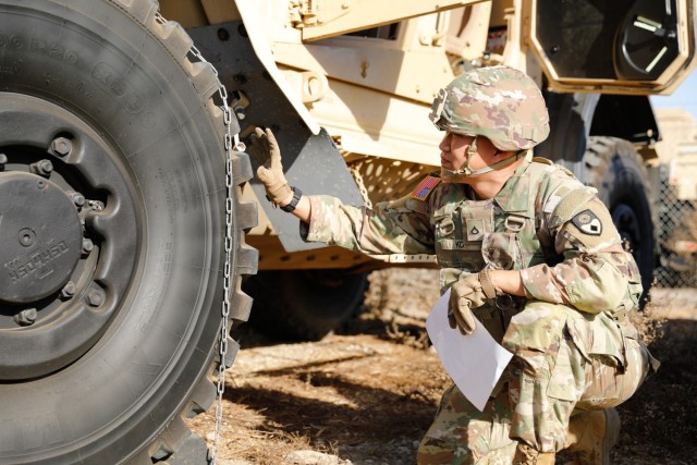 U.S. Army Pfc. Elliott Ko, 40th Military Police Company, conducts preventive maintenance checks and services (PMCS) on a M-ATV Mine Resistant Ambush Protected (MRAP) vehicle to help support emergency services at the Palisades fire at Joint Forces...
