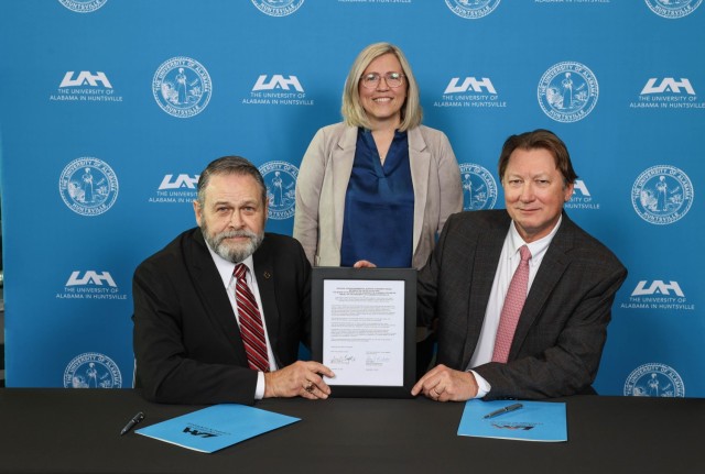 A memorandum of understanding was signed between UAH Systems Management & Production Center and the Installation Management Command's ID-Sustainment in December. Pictured are Davis D. Tindoll, Jr., ID-S Director; Ishella Fogle, UAH Students...